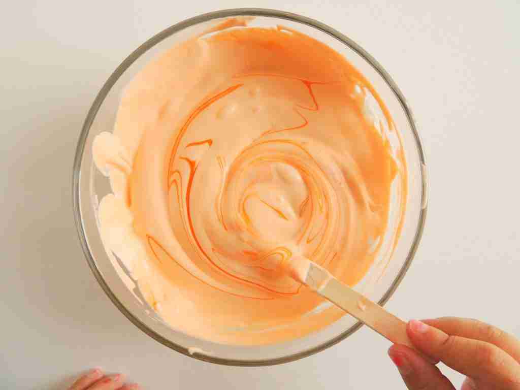 mixing up orange puff paint