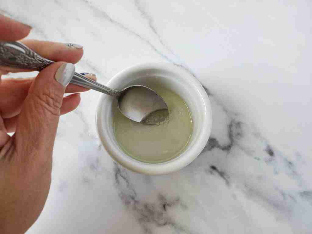 mixing the wet ingredients for a bath bomb