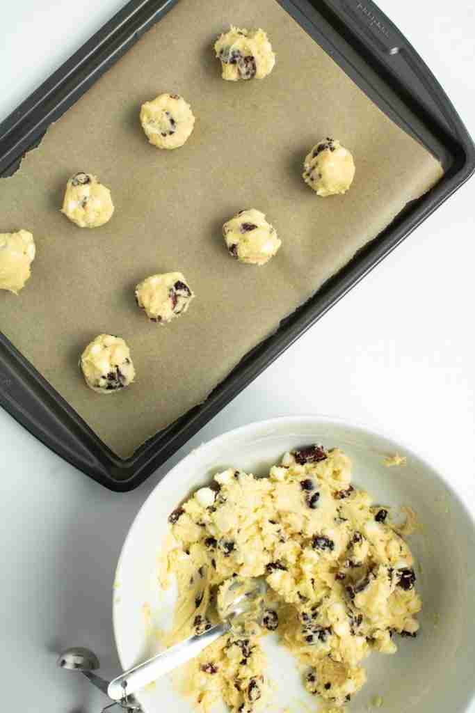 cookie dough balls on a baking sheet