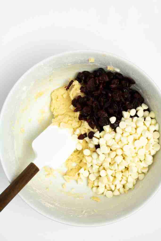 Adding cranberries and white chocolate chips