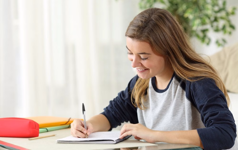 teenage girl writing a story